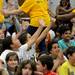 Logan Elementary School students high five their teachers after a surprise flash mob dance performance during a year-end assembly on Friday morning. Melanie Maxwell I AnnArbor.com